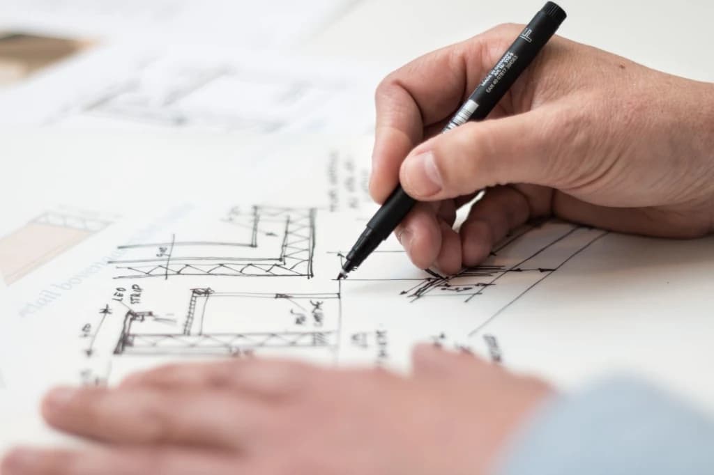 Architect sketching home construction plans in Forest Hill, Toronto
