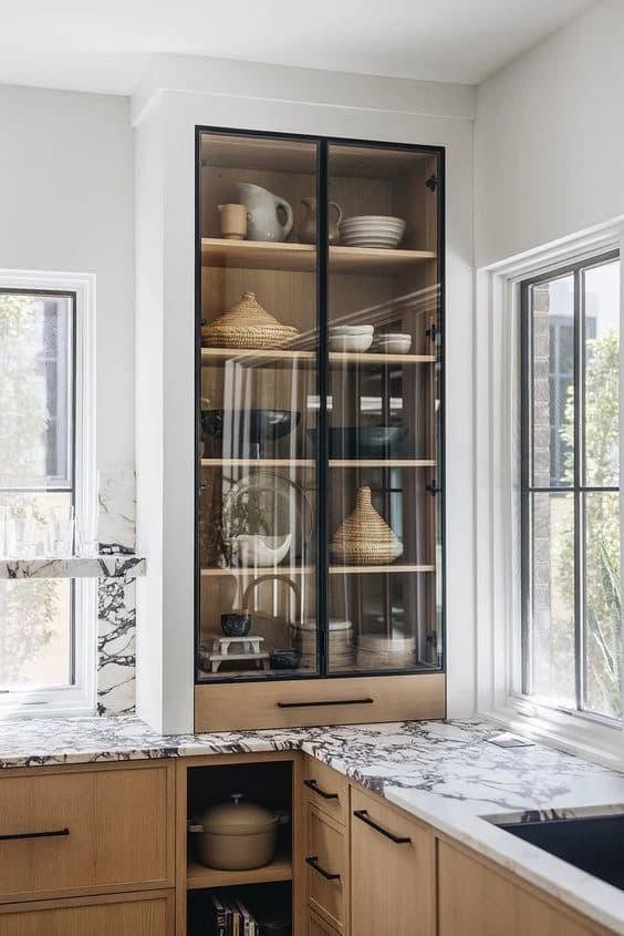 Modern kitchen with display cabinet and marble countertops in Forest Hill, Toronto