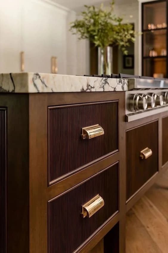 Luxury kitchen island with marble and brass hardware in Rosedale, Toronto
