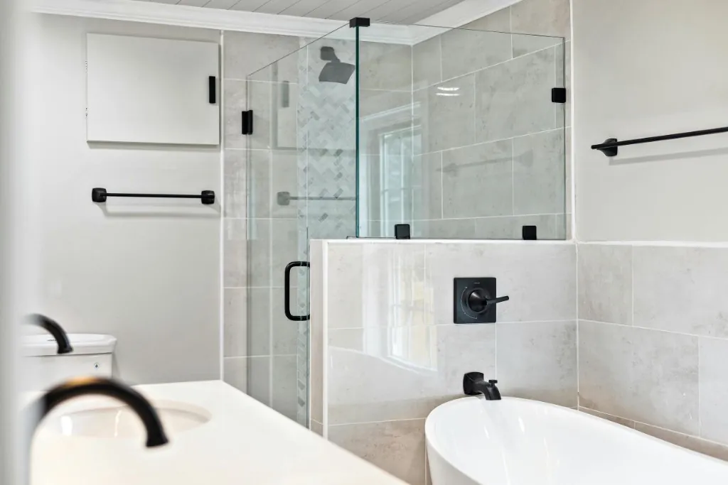 Freestanding tub with herringbone marble accent bathroom renovation in Toronto