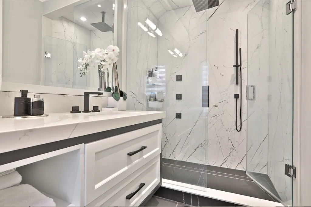 Primary ensuite with freestanding tub and glass shower in Yorkville, Toronto