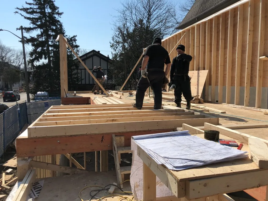 Second floor addition framing and blueprints on site in Forest Hill, Toronto