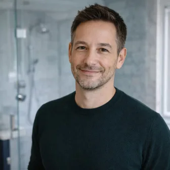 Mark F. with walk-in glass shower in condo bathroom in The Annex, Toronto